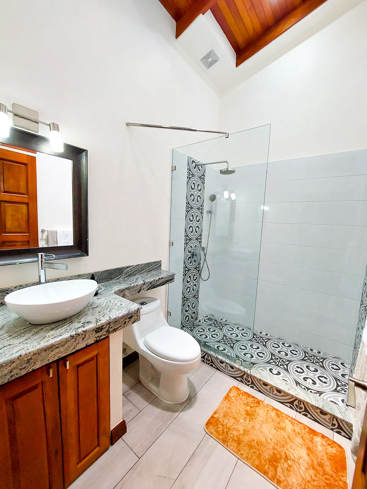 Second bathroom with clean modern design and good lighting
