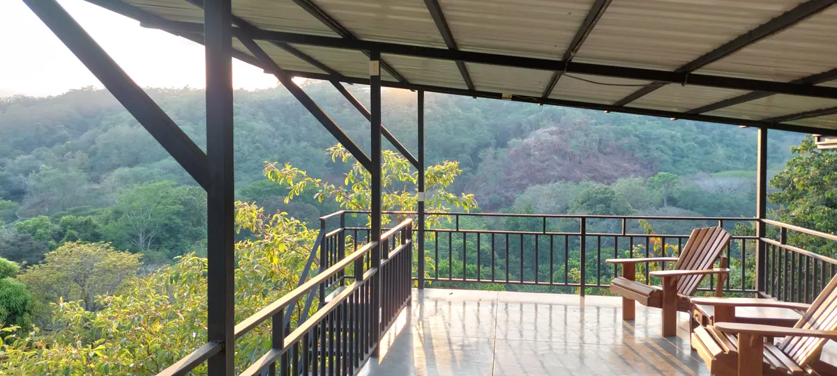 Expansive panoramic vista from the lookout with ocean and jungle views