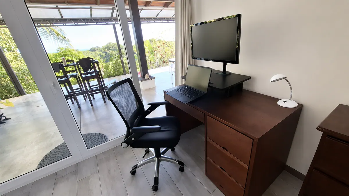 Private office space in master suite with standing desk option