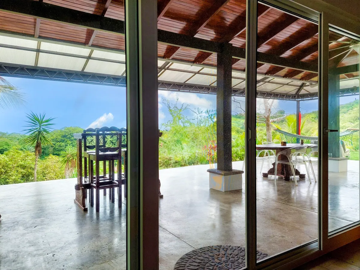 Master bedroom with patio doors opening to private outdoor space