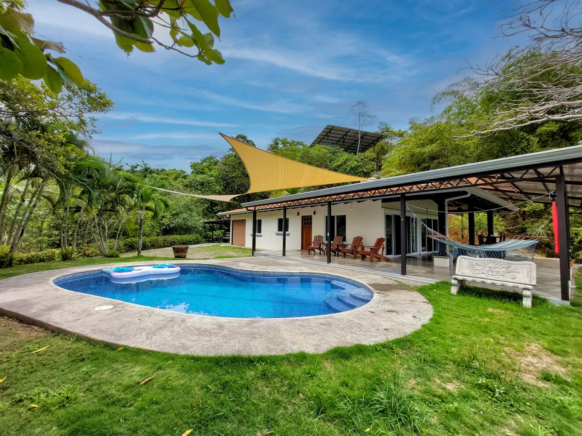 Pool area with villa architecture visible showing tropical design