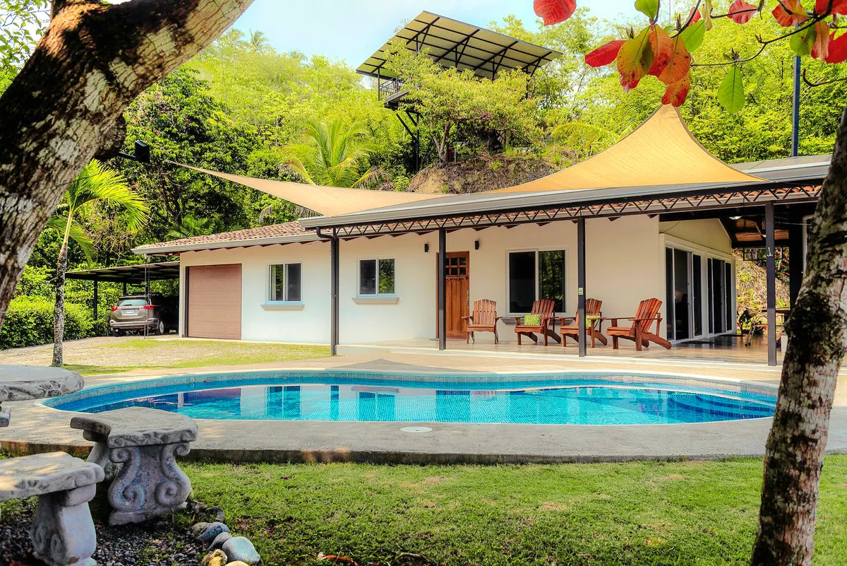 Shaded picnic area beside the pool perfect for outdoor meals